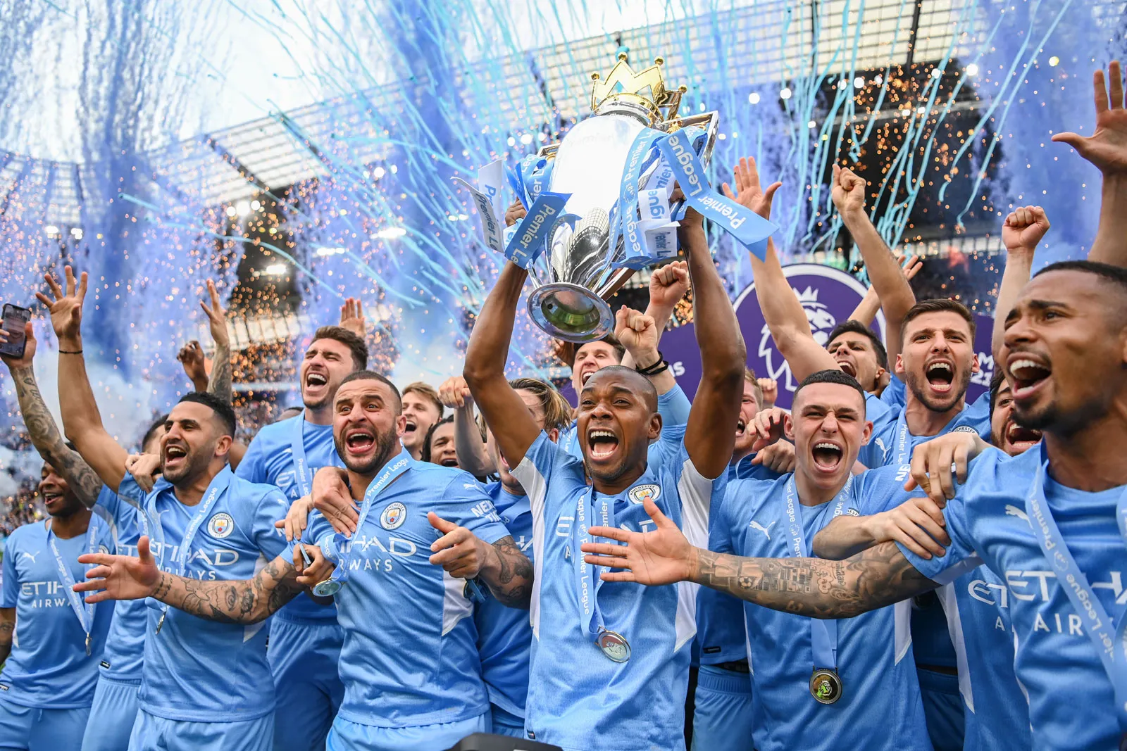 1770168710_Manchester-City-Football-Club-team-celebrates-with-Premier-League-trophy-championship-May-22-2022.webp