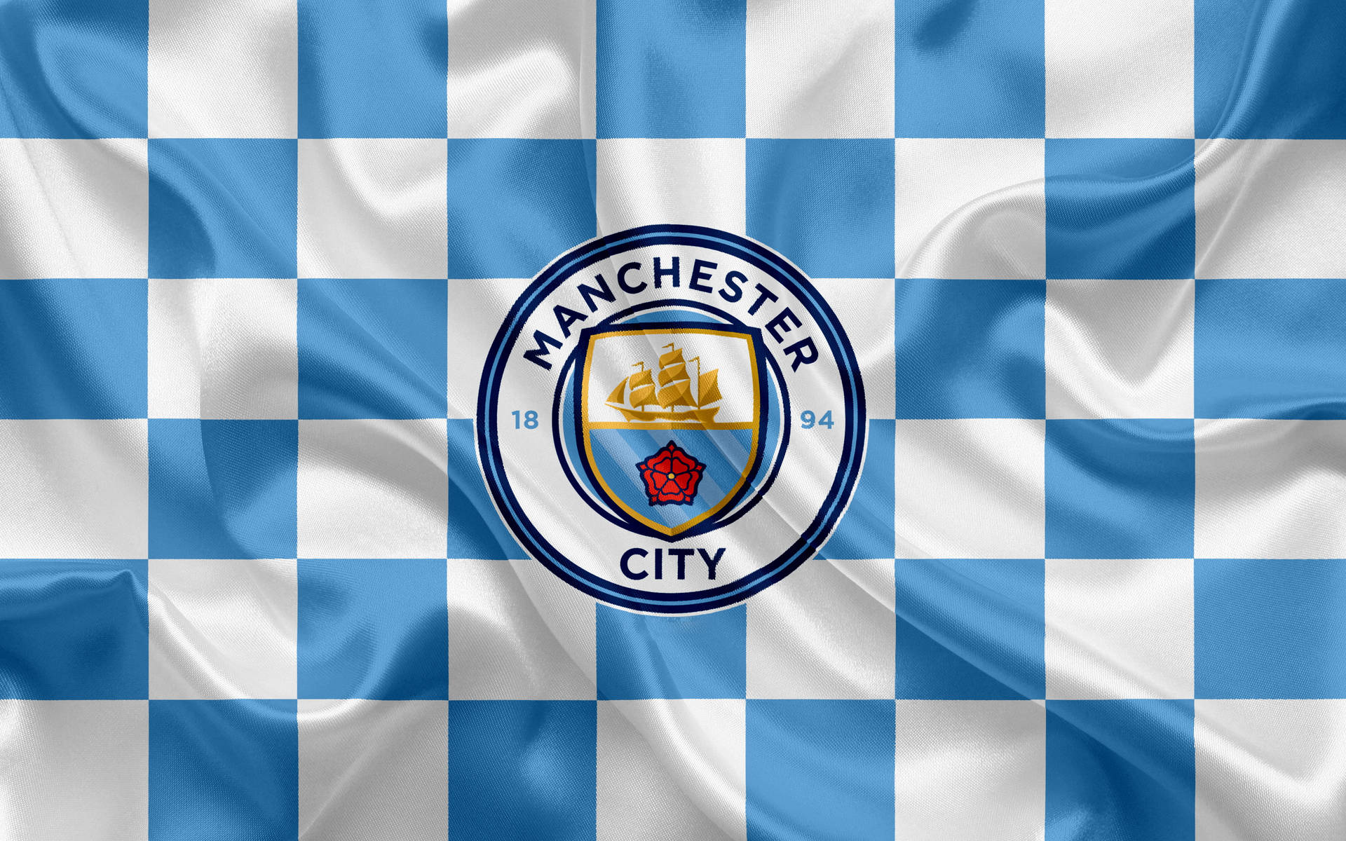1771169039_manchester-city-logo-on-checkered-cloth-nhs1m2uypzxi0rc7.jpg